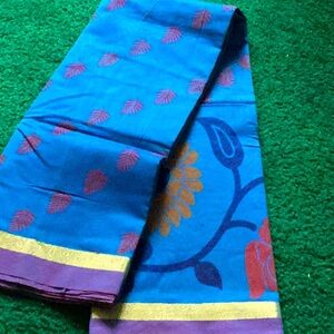 Blue floral chanderi  silk  saree with thin zari border.